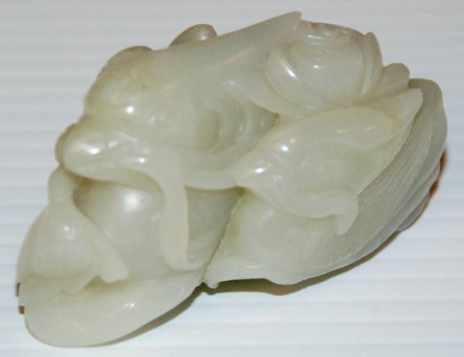 Jade paper weight depicting two ducks in a lotus pond