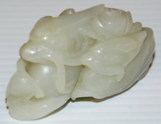 Jade paper weight depicting two ducks in a lotus pond