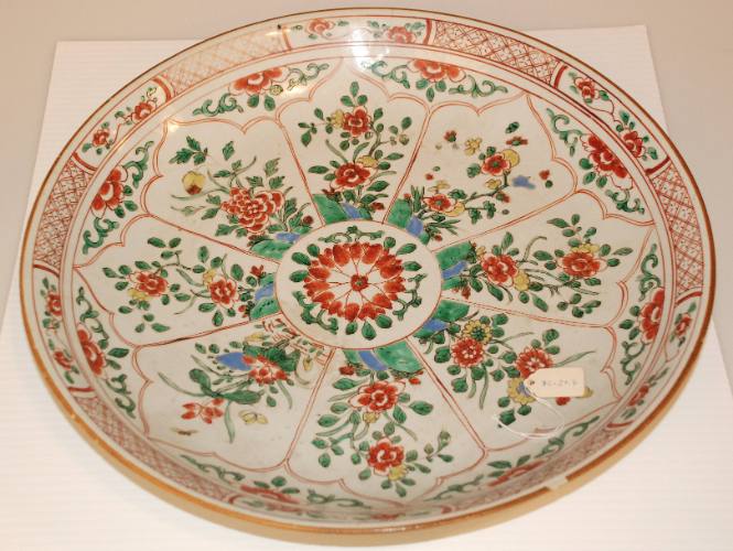 Chinese porcelain large dish with famille verte decoration with 8 panels of flowers and rockery