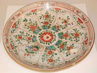 Chinese porcelain large dish with famille verte decoration with 8 panels of flowers and rockery