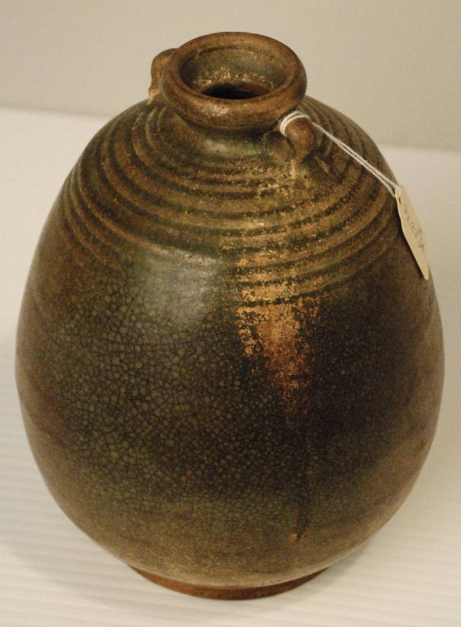 Ovoid jar with slight neck, small loop handles and unglazed base