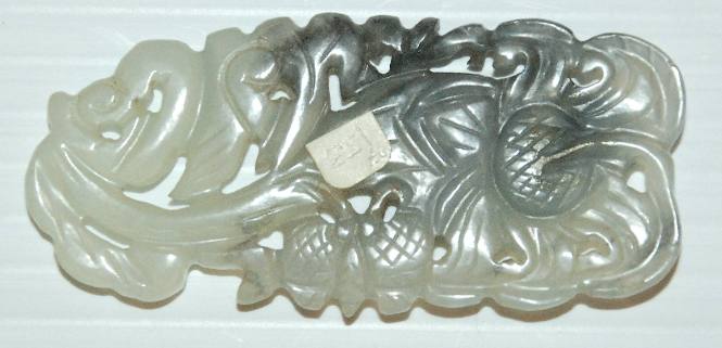 Medallion with melon, butterfly and flower motif