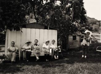 Woman and Man Sitting in Yard (Millerton Portfolio)