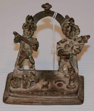 Shiva and Parvati standing on an alter