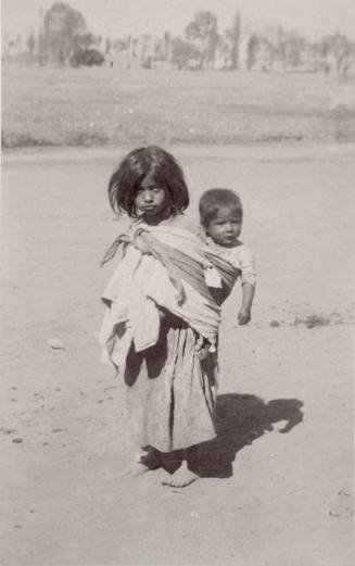 A Mexican Little Girl with a Baby