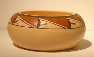 Pot with brown and rust designs on buff