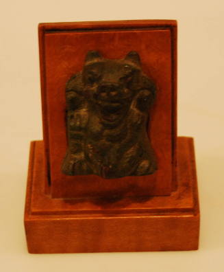 Miniature bear on wooden stand