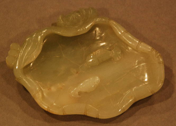 Jade water receptacle in the form of a curled lotus leaf with bloom on the exterior and two fishes in relief inside