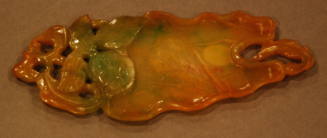 One of a pair of jadeite palettes in the form of a flattened lotus leaf with stem and foliage with a fish