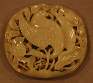 Jade reticulated scepter ornament carved in three dimensions depicting a crane in a lotus pond surrounded with lotus and water plants