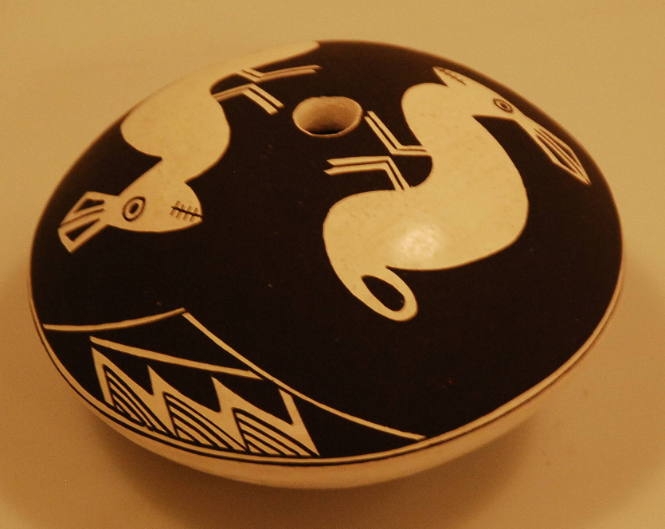 Black-on-white seed pot with mimbres rabbit motif