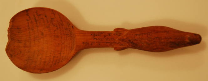 Spoon with seal handle