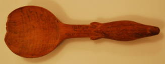 Spoon with seal handle