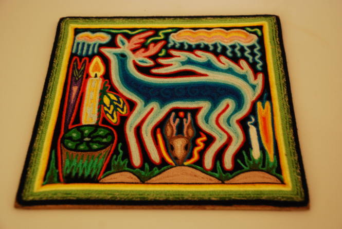 Yarn painting with deer and peyote
