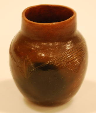 Pitch Coated Pot Signed EG