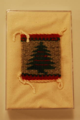 Miniature rug with pine tree design