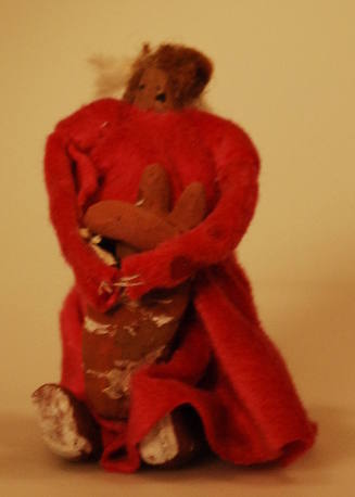 Toy figure of Navajo mother with child