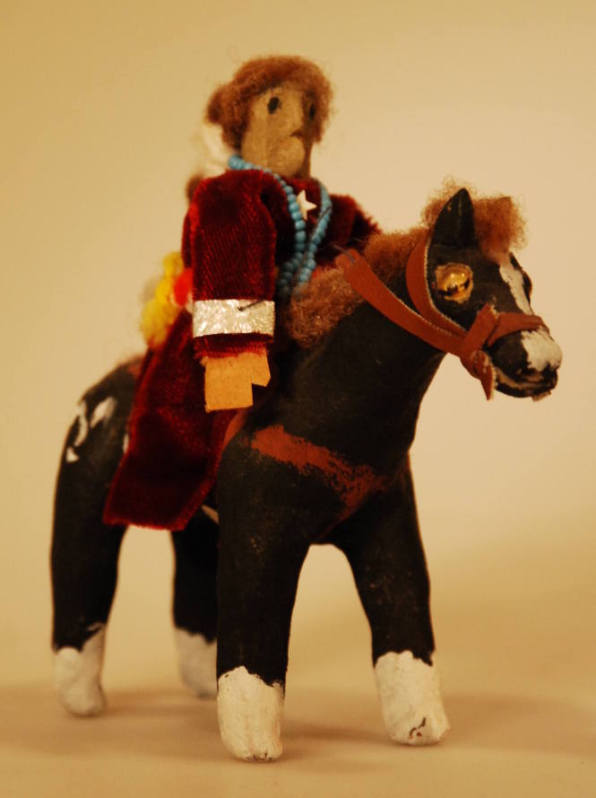 Toy figure of Navajo women on horseback