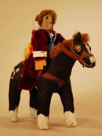 Toy figure of Navajo women on horseback