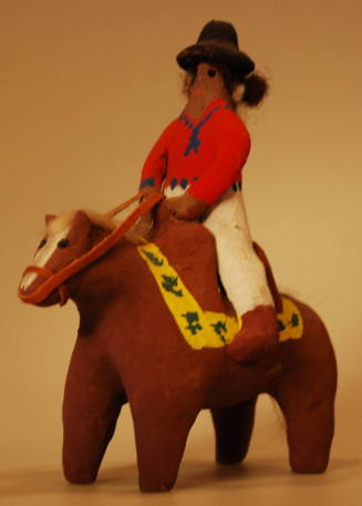 Toy figure of Navajo man on horseback