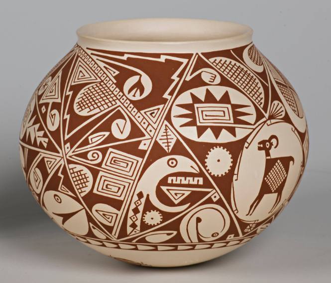 Brown on white Mimbres design pot with goat, snake and bee