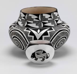 Black-on-white pot with two Mimbres style bears