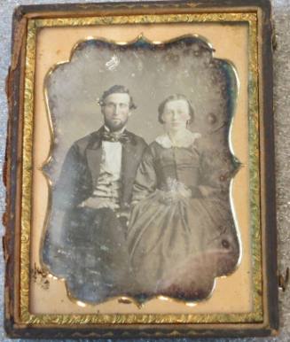 Seated Fancy-dressed Couple