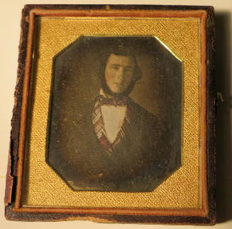 Close-up of Man with Sculpted Beard, Tinted Vest, and Bowtie
