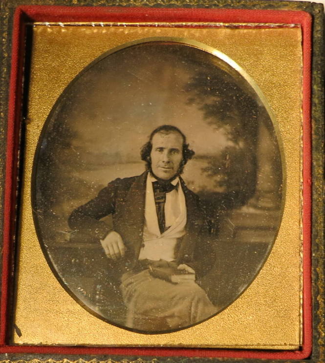 Seated Man in White Vest, with Elaborately Painted Background with Lake and Column