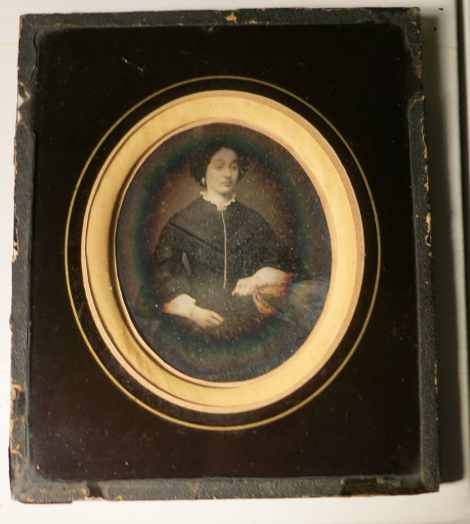 Seated Woman with Hand on Table