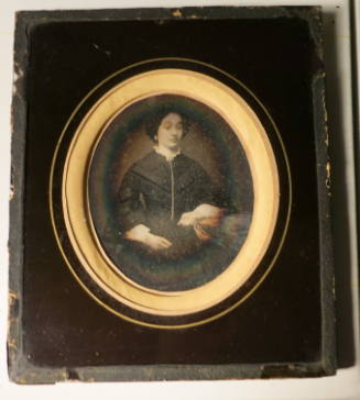 Seated Woman with Hand on Table