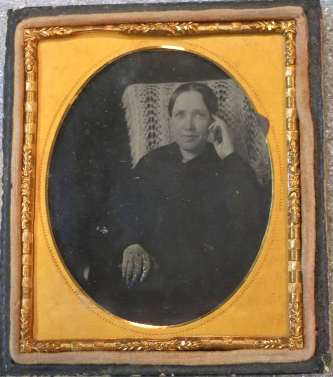 Seated Woman with Finger to Temple