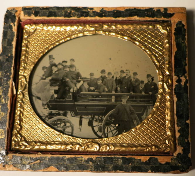 Twenty Well-dressed People in a Carriage