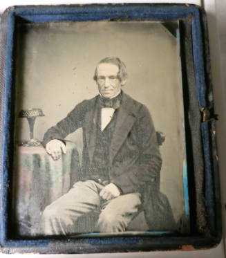 Seated man, Vase on Table