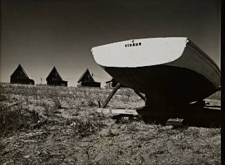 Rural landscape with boat and A-frame houses