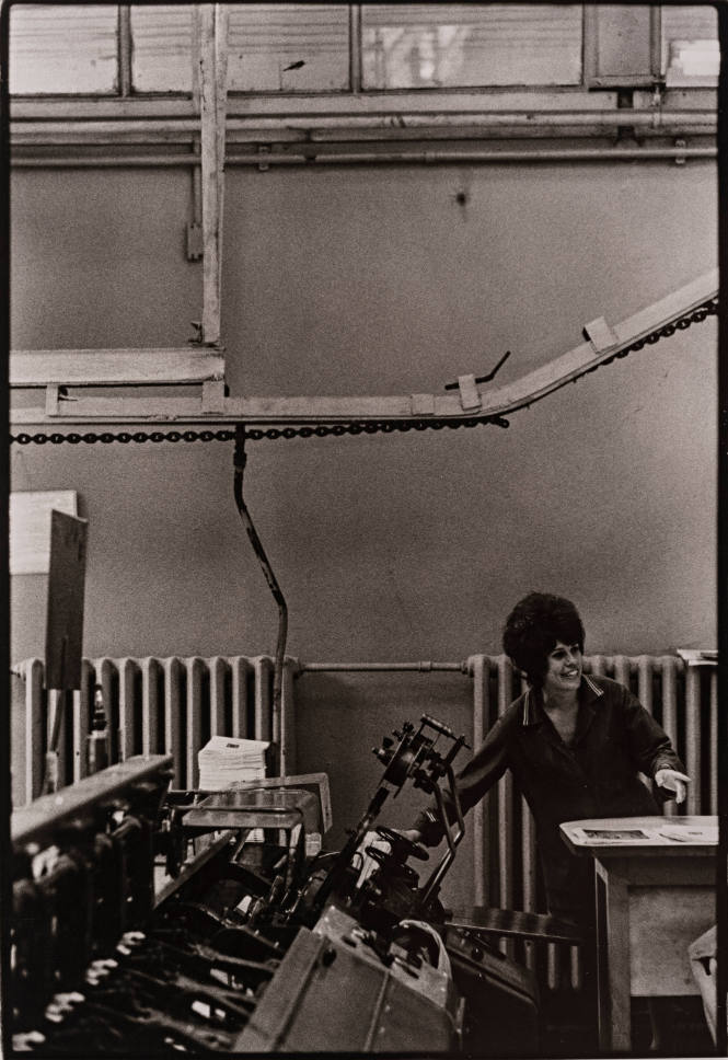Soviet Union (female worker at desk reaching over to printing press)