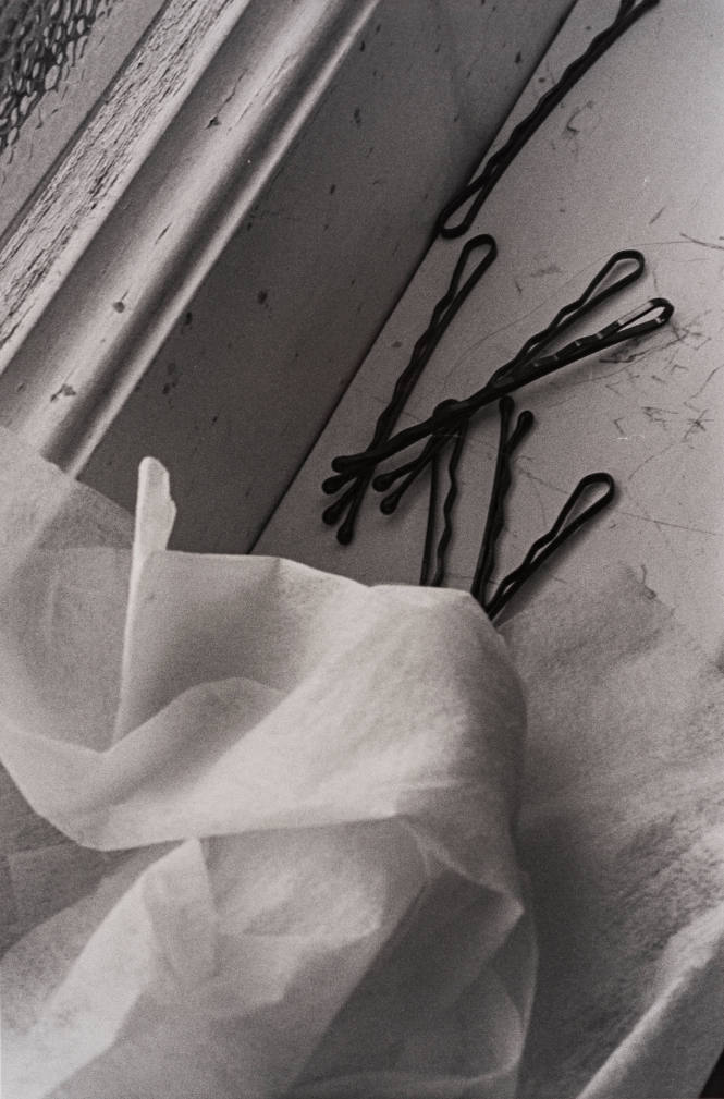 Silver Creek Series (close-up of hair pins and tissue on window sill)