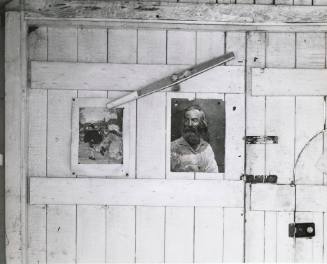 Interior - Dylan Thomas' Work Shed, Laugharne, with prints of Pieter Bruegel's Dancing Villagers and Walt Whitman