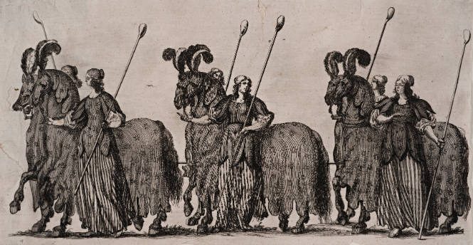 Women standing with costumed horses