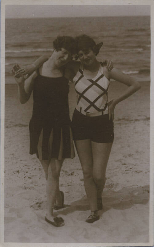 Untitled [Two women at the beach with their arms around each other's shoulders]
