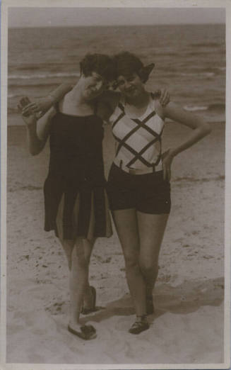 Untitled [Two women at the beach with their arms around each other's shoulders]