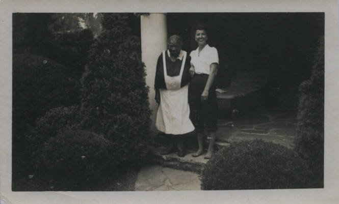 Untitled [Two women stand in porch steps]