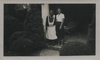 Untitled [Two women stand in porch steps]