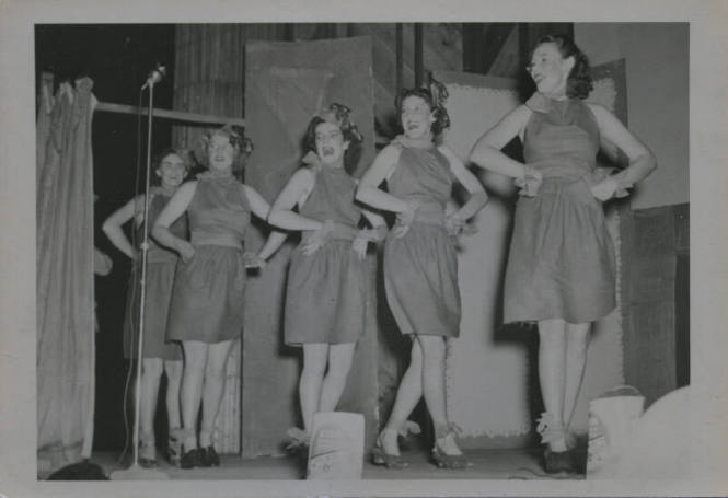 Untitled [Five women step on to stage, hands on hips]