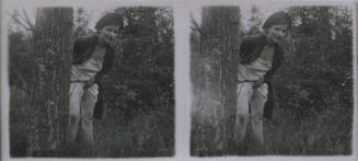 Untitled [Woman stands behind tree, holds up dress (repeated horizontally)"
