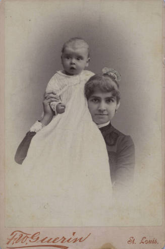 Untitled [Woman holds child on shoulder]