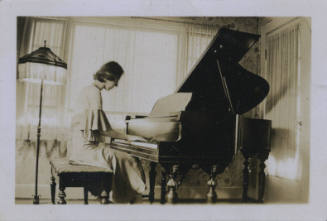 Untitled [Woman sits, plays piano (copy of 2015.12.1.183)]