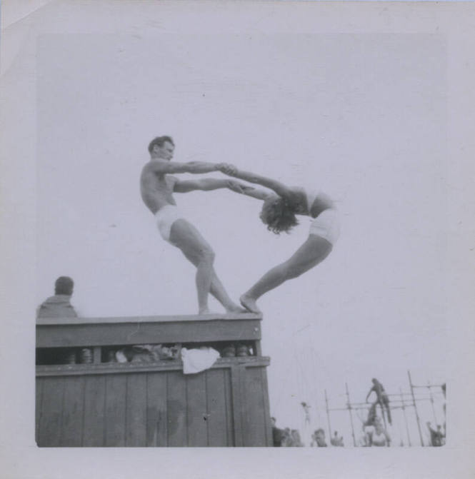 Untitled [Woman bends backwards, man holds her hands]