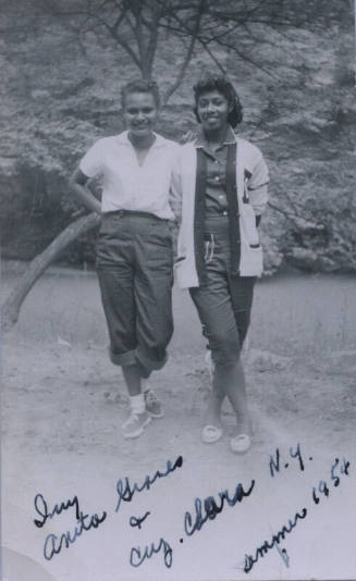 Untitled [Two women stand on field]
