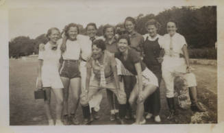 Untitled [Nine women stand on field]